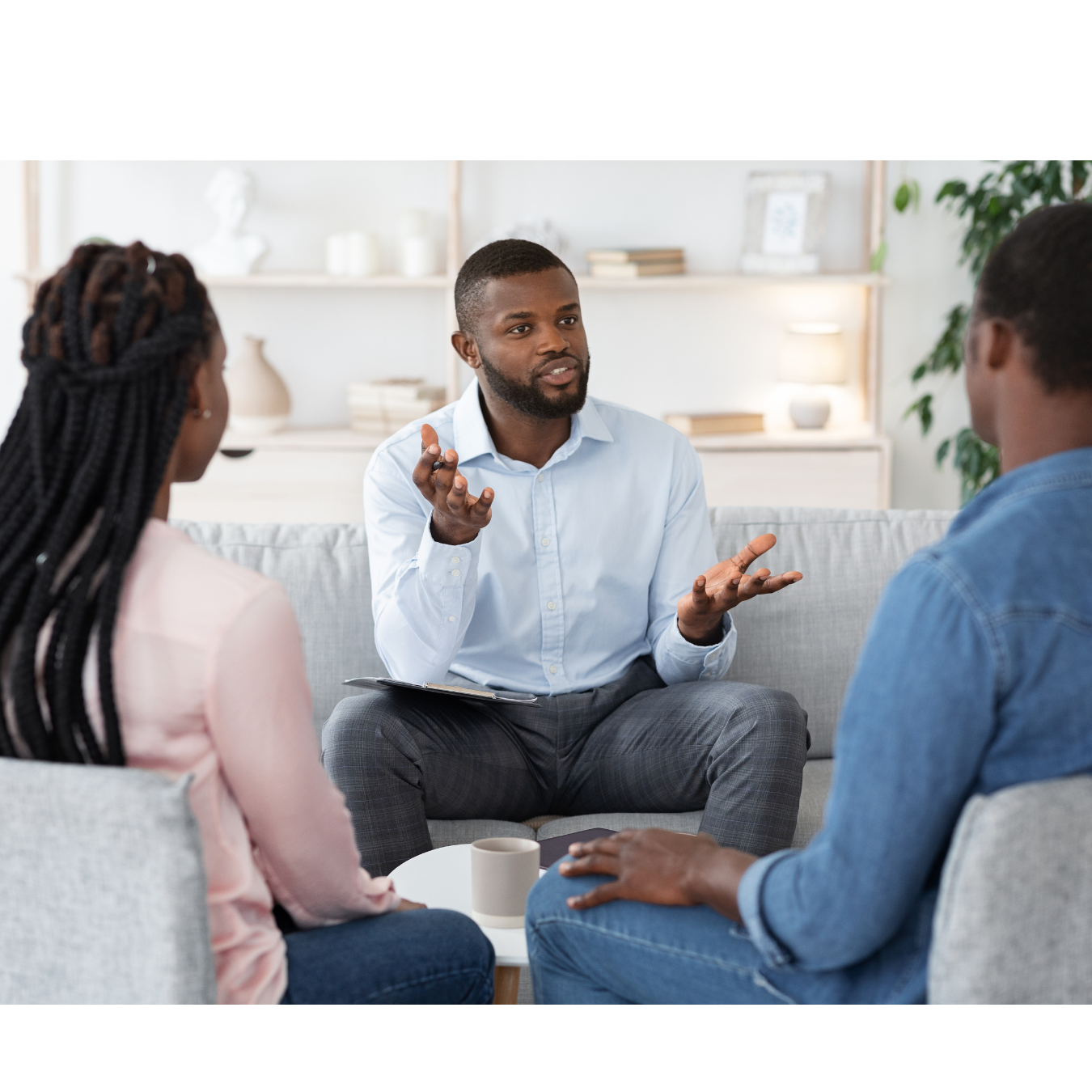 A debt review advisor discussing options with a couple during a session